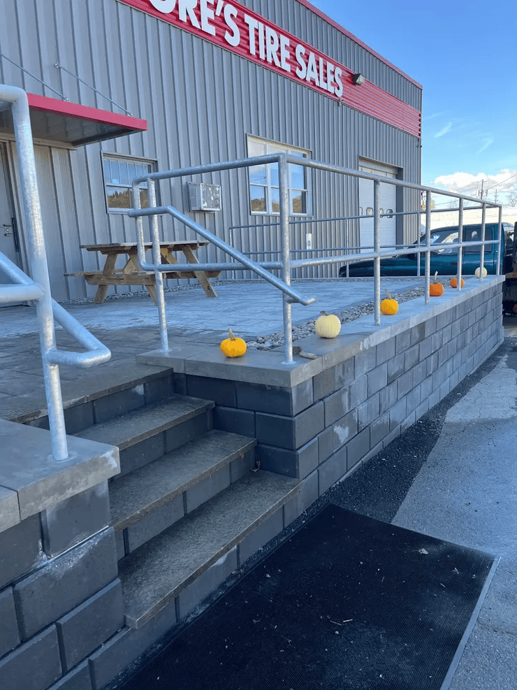 Tire shop entrance decorated with pumpkins